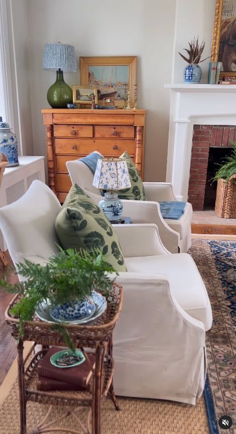 Cottage Blue Living Room, Grand Millennial Fireplace, Nantucket Home Interior, Green And Blue Home Decor, Traditional Coastal Maximalism, Grandmillenial Style Living Rooms, Grandmillennial Living Room, Grand Millennial Living Room, Grandmillenial Living Room