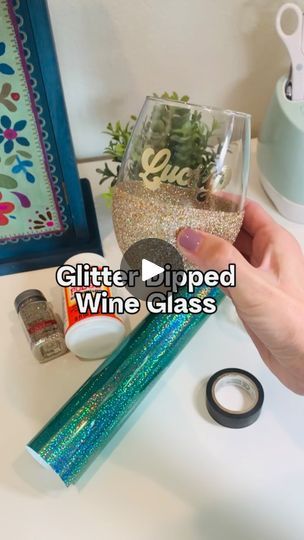 17K views · 4.1K reactions | How to make a glitter dipped wine glass with peekaboo shamrocks ☘️

These glasses are so fun and festive! For the peekaboo shamrocks, be sure to choose a vinyl that has color on both sides. I used @cricut holographic vinyl. 

You’ll also need extra fine glitter, mod podge, and electric tape. I like electric tape because it has a little stretch, but you can also use painter’s tape! 

#glitteredwineglass #stpatricksdaycrafts #cricutcrafts #modpodge #glitterdipped #cricutideas #crafttutorials | Lisa I Cricut Tutorials & Crafts | Babe Rainbow · Peace Blossom Boogy Babe Rainbow, Printed Wine Glasses, Glitter Wine Glasses Diy, Wine Glass Vinyl, Glitter Wine Glasses, Rainbow Peace, Diy Wine Glasses, Mermaid Glitter, Spring Decorating