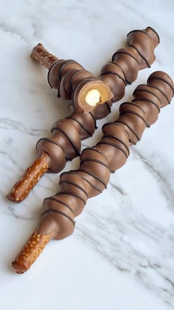 Andrea Carruth on Instagram: "Milk chocolate dipped caramel wrapped pretzels 😍 These will be added to the website this weekend so snag some before they’re gone! For these I used @callebautchocolate and Peter’s Caramel. . . . . #peterscaramel #callebaut #chocolatework #chocolatedipped #chocolatedippedpretzels #caramelpretzels #chocolatecoveredstrawberries #candymaking #candymaker #chocolateinspo #hotchocolate #hotchocolatebombs #cocoabombs #caramel #fall #autumn #falltreats #foodporn #foodie #i Caramel Covered Pretzels, Caramel Pretzel Rods, Carmel Chocolate Pretzels, Carmel Chocolate, Bavarian Pretzel, Chocolate Pretzel Rods, White Chocolate Oreos, Chocolate Caramel Pretzels, Chocolate Covered Pretzel Rods