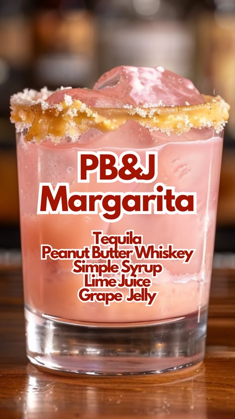 Experience a fun twist on a classic cocktail with the PB&J Margarita. This drink combines tequila, peanut butter whiskey, and grape jelly, topped with a peanut butter rim and fresh fruit.  #pb&jmargarita via @mybartender Pb&j Cocktail, Grape Cocktails, Winter Holiday Recipes, Simple Syrup Cocktails, Flavored Margaritas, Tequila Margarita, Cocktail Recipes Whiskey, Cocktail Syrups, Grape Jelly