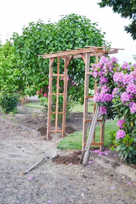 A DIY garden arch made with redwood Garden Arches Ideas Backyards, Rose Arches Garden, Garden Arches Ideas, Garden Arch Ideas, Arches Garden, Diy Arbour, Flower Arches, Garden Archway, Wooden Arbor