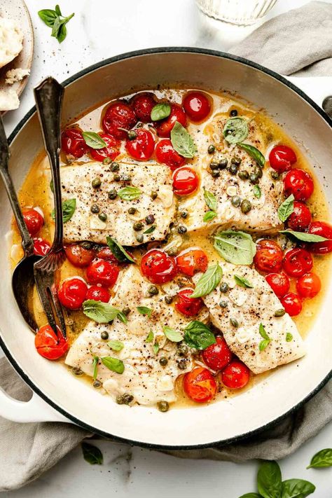 Ready in 20 minutes, White Wine Steamed Fish with Burst Tomatoes is a low-effort dinner dream! Layer white fish fillets in a skillet with cherry tomatoes, capers, & white wine, then the stove does all the work! The fish gently steams until flaky & tender, while the wine reduces into a white wine butter sauce. Serve with fresh herbs, rice, & veggies for a fast, fresh, & healthy meal! (Pescatarian) #steamedfish #howtosteamfish #steamedfishrecipes #fishrecipes #pescatarianrecipes #easydinneridea How To Grill Sausage, Scallop Recipes Healthy, Burst Tomatoes, Wine Butter Sauce, Steamed Fish Recipes, White Wine Butter Sauce, Steam Fish, Coconut Crusted Chicken, Best Turkey Burgers