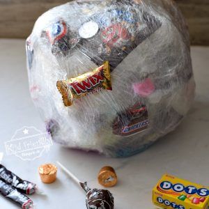 Candy Ball Game, Plastic Wrap Ball, Gift Wrap Game, Family Easter Games, Saran Wrap Ball Game, Willy Wonka Party, Fun Halloween Party Games, Thanksgiving Games For Kids, Fun Christmas Party Games