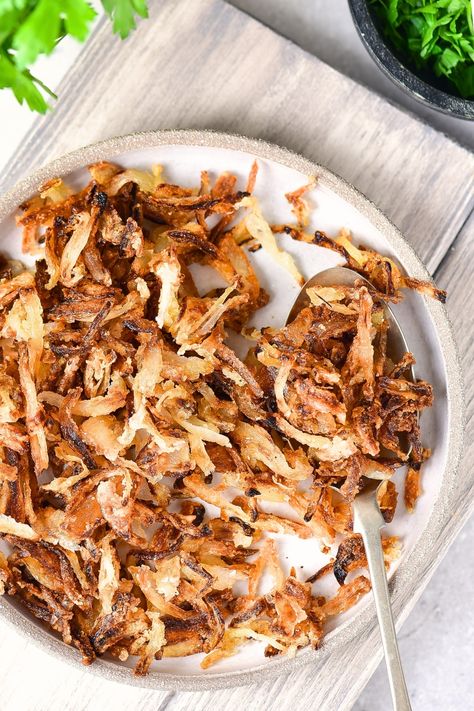 These gluten-free fried onions are easy to make, flavorful and deliciously crispy! They're perfect for topping your favorite casserole, or sprinkled on creamy soups for extra taste and crunch! Or eat them as a savory snack on their own! Totally dairy-free and vegan too. Gluten Free Fried Onion Topping, Onion Strings, Creamy Soups, Favorite Casseroles, Crispy Onions, Creamy Soup, Fried Onions, Savory Snacks, Lactose Free