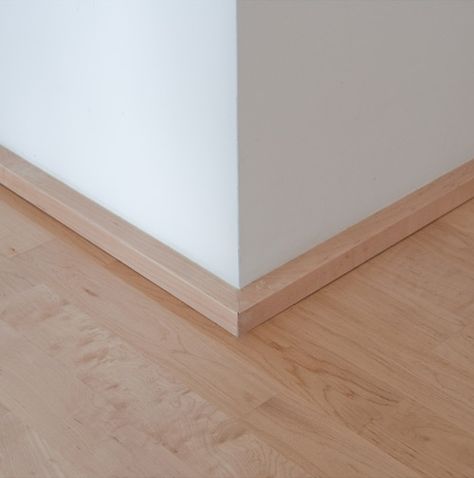 the low profile section covers the gap between the drywall and the floor and also provides a bumper for shoes, vacuum cleaners, etc. At hardwood applications we tend to match the base with the hardwood (in this case maple), at carpet applications we’ll paint the base trim something close to the carpet. The end goal is to achieve a subtle profile that doesn’t draw your attention to the base. The low profile of the 1×1 base often works much better with window systems Modern Baseboards, Floor Skirting, Baseboard Styles, Modern Trim, Baseboard Trim, Baseboard Molding, Base Moulding, Floor Trim, Base Trim