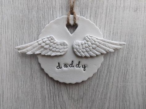 A gorgeous hanging decoration stamped with your choice of wording and adorned with a pair of angel wings. (Please note the font used does not contain capital letters, any names/words will be in lower case) Each piece is made from a white air drying clay and hung using a natural twine. All of my items are lovingly hand made so each one is individual and personal to you, please send a message with your order to specify the details the wording you would like. This will make a beautiful addition to Air Dry Clay Angel Wings, Polymer Clay Angel Wings, Clay Angel Wings, Angel Clay, Christmas Tree Feathers, Clay Angels, Clay Angel, Air Drying Clay, Feather Angel Wings