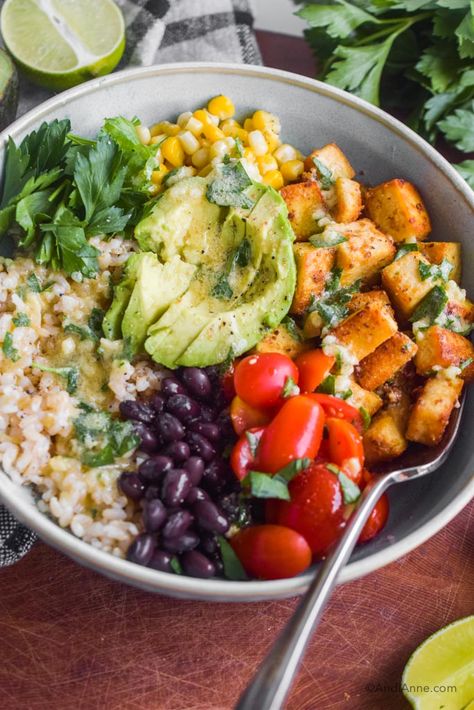 Crispy Tofu Burrito Bowl With Lime Dressing - AndiAnne Tofu Avocado Bowl, Mexican Tofu Bowl, Tofu Burrito Recipe, Tofu Burrito Bowl, Tofu Burrito, Ways To Cook Tofu, Tofu Rice, Vegetarian Burrito, Rice Black Beans