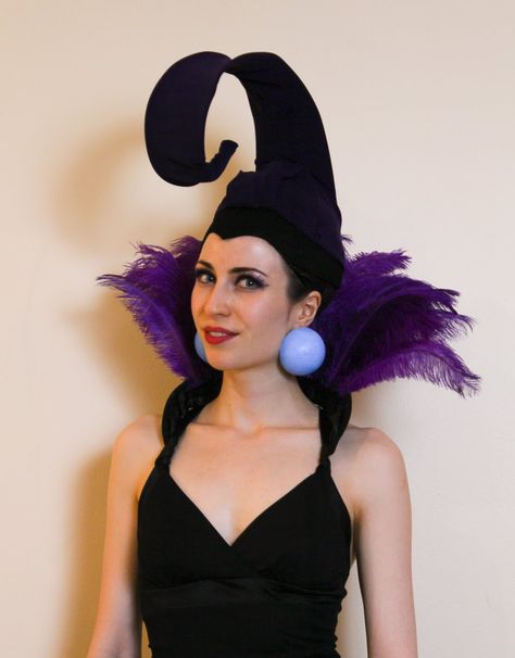 Inexpensive & easy Yzma costume from The Emperor's New Groove - made from feathers, coat hangers and a cloche hat. Diy Yzma Headpiece, Ezma Emperor's New Groove Costume, Yzma And Kronk Costume Diy, Emperors New Groove Trunk Or Treat, Kronk Costume Diy, Izma Costume Diy, Emperors New Groove Costume Family, Emporers New Groove Costumes, Emporers New Groove Costume