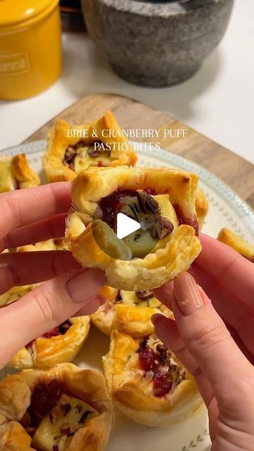 Georgina Thomas on Instagram: "Brie & cranberry puff pastry bites

12 tsp cranberry sauce
180g brie @presidentuk 
Handful chopped pecans
2 tbsp chopped rosemary 
Egg wash 
1 sheet (320g) puff pastry @jus_rol 

Cut puff pastry sheet into 12 squares and add to a heavily buttered / baking paper lined muffin tray. Using baking paper or even a silicone muffin tray ensure they won’t stick to the pan. Add the tsp cranberry sauce, chunk of brie, pecans, rosemary, salt and pepper. Bake for around 15 mins, until the brie is melted and the pastry is crispy all the way round, including the bottom. Enjoy!

#brie #cranberry #christmas #winter #festivefood #christmasfood #pecans #holidays #holidayseason" Baked Brie In Puff Pastry With Jam, Cranberry And Brie Puff Pastry Wreath, Recipes Fingerfood, Cranberry Puff Pastry, Awesome Cocktails, Beef Tenderloin Roast Recipes, Puff Pastry Bites, Thanksgiving Apps, Cranberry Bites