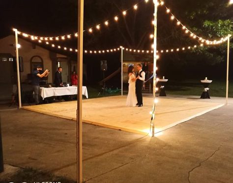 Made pretty with cafe lights.10 ft poles (4x4 split) painted white screwed to steel pins painted white, in a hole drilled into the concrete Diy Dance Floor, Cafe Lights, Backyard Wedding, Dance Floor, White Painting, Split, Cafe, Pins, White