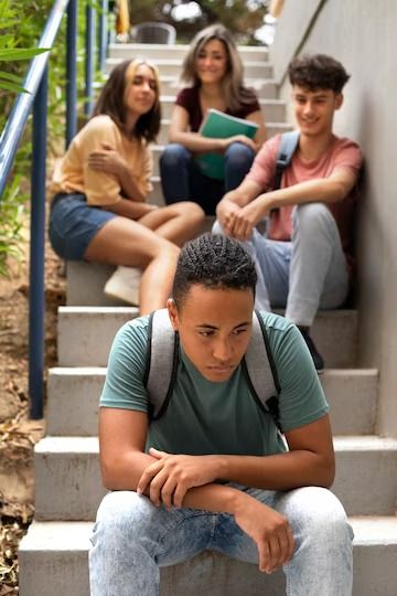 Free Photo | Sad boy sitting on stairs front view Stairs Front View, Sitting On Stairs, Online Psychologist, School Refusal, Online Counseling, Hate School, Behavior Modification, Sleep Issues, School Staff