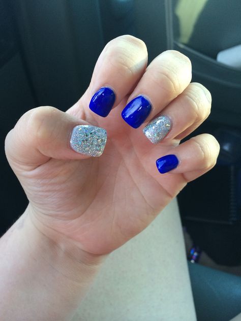 Royal blue with silver glitter  nails Royal Blue And Silver Nails Short, Royal Blue And Silver Nails, Volleyball Nails, Rodeo Nails, Blue Prom Nails, Blue And Silver Nails, Hoco Nails, Black Nails With Glitter, Silver Glitter Nails