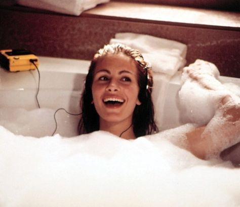 A bath fit for a queen. | 10 Most Iconic Movie Scenes Ever To Take Place In The Bathroom In The Bathtub, Pretty Woman, A Woman, Headphones, Water, Hair