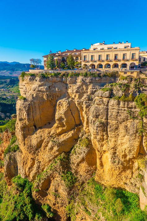 Ronda is a unique hilltop town in Andalusia, Spain built right on the edge of a cliff! Here are the best things to do in Ronda Spain. #ronda #andalusia #andalucia #seville #granada #cordoba #cadiz #spain #travel #itinerary Spain Ronda, Spain Travel Itinerary, Andalusia Travel, Edge Of A Cliff, Ronda Spain, Cadiz Spain, Spain Trip, Prague Travel, Popular Travel Destinations