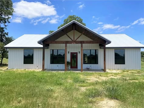 1001 Fm 3403, Lexington, TX 78947 Farmhouse Porch On Double Wide, Metal Building Homes 4 Bedroom, Simple Bardominum Ideas, Black And White Metal House, Metal House Exterior Colors, Barndominium Shop Ideas, Metal Home Exterior, Small Shop House Plans, Small Barndominium Ideas Exterior