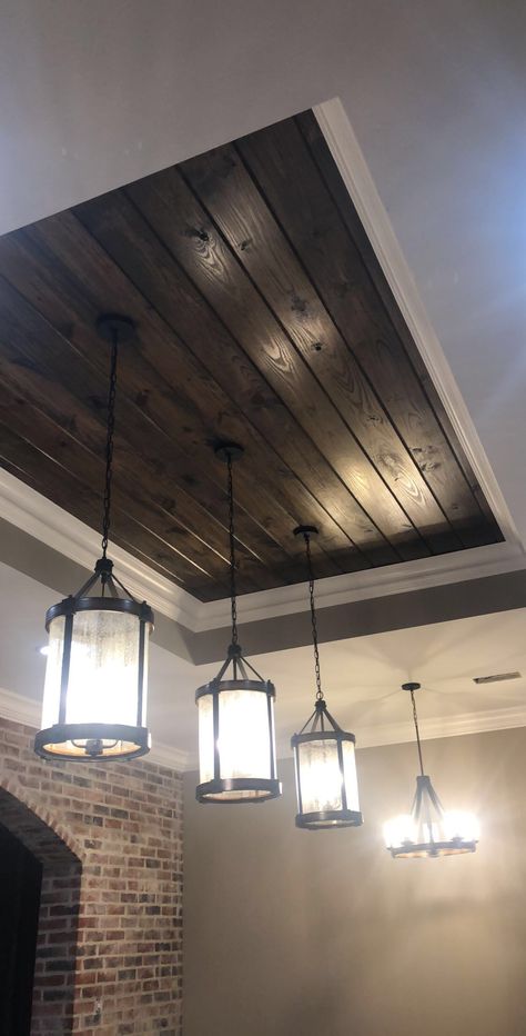 Dark walnut stain on pine tongue and groove tray ceiling. Kichler Barrington large pendant lights. Brick wall is Acme brick Williamsburg, king size, standard mortar light sack finish Wooden Island Lighting, Dark Wood Ceiling, Brick Wall Wood Ceiling, Tongue And Groove Tray Ceiling, Dark Stain Tongue And Groove Ceiling, Rustic Tray Ceiling, Cypress Wood Ceiling, Wood Tray Ceiling, Tray Ceiling Lighting