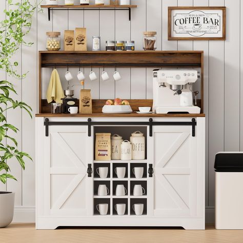 PRICES MAY VARY. 【Large Storage Space】Boasting 6 hooks and 9 wine rack, this coffee bar cabinet offers ample storage space for your showcase needs. 2 farmhouse style barn doors has adjustable shelves inside to accommodate various sized items. The 2-tier tabletop of this coffee bar which can perfect to organize your coffee maker, coffee beans, cups, jars and etc. 【Sturdy and Safe】This coffee bar is made of high quality P2 particle board, upgraded base and 12 back buckles make this coffee bar cabi Bar Cabinet With Shelves, Coffee Bar Cabinet Ideas, Sideboard Coffee Bar, Bar Buffet Cabinet, Coffee Bar Ideas Kitchen Counter, Coffee Bar Cabinet, Farmhouse Sideboard Buffet, Home Bar Cabinet, Farmhouse Coffee Bar