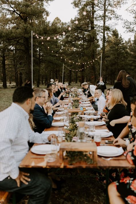 Can you picture yourself having a dinner reception on this long table in the woods of Flagstaff, Arizona? I know I can! This intimate and cozy micro wedding in Flagstaff was so dreamy. The wedding had bistro lights above the table and a long garland on the long wooden reception table. Take a look at the full gallery on our blog! #flagstaffwedding #flagstaffelopement #flagstaffphotographer Reception In The Woods, Micro Wedding In The Woods, Flagstaff Wedding Venues, Flagstaff Arizona Wedding, Wood Table Wedding, Wedding Photography Shots, Long Table Reception, Nordic Village, Flagstaff Wedding