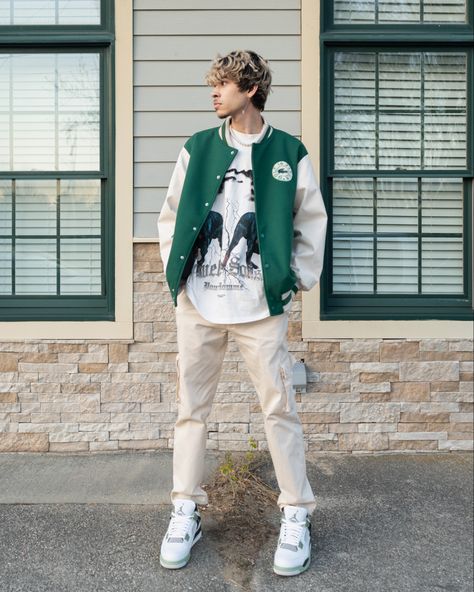 Man wearing Green varsity jacket outfit with Jordan 4s seafoam at a photo location for Instagram mens fashion Green Varsity Jacket Outfit, Outfits With Jordan 4s, Pine Green Outfit, Jordan 4 Outfit Men, Jordan 4 Outfits, How To Style Jordans, Varsity Outfit, Green Jacket Outfit, Jordan 4 Outfit