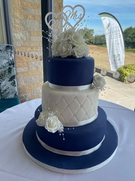 "Beautifully arranged set of artificial wedding cake decorations. Made up of roses and pearl strands to fit a 6\" top tier, along with 2 matching sprays for lower tiers.  These are made to order in your colour scheme.  If the option is not available on the drop-down list, please message me to confirm your colour.  Different options are available if you only require the topper or a different number of tier sprays.  For the topper alone it is £12.50 plus postage and single sprays are £5 each.  These are both listed separately in my shop. Discounts can be applied to a larger number of sprays for cakes that are 4 tiers and above. Wedding Cake Flower Topper Set" Red And Blue Wedding Cake, Royal Blue Wedding Cake, Navy Blue Cake, Royal Blue Wedding Cakes, Blue Wedding Cakes, Royal Blue Cake, Wedding Cake Flower, Wedding Cake Blue, 2 Tier Wedding Cake