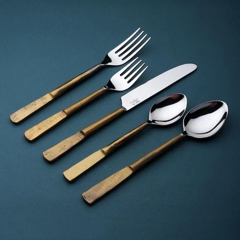 Our Celia handmade flatware showcases faceted handles with flattened ends. Balanced with depth and clarity for handheld comfort, this hand-forged stainless steel design makes Celia silverware perfect for everyday or special occasions. * Made from rust-resistant 18/8 stainless steel with textured flattened handles * Each silverware setting includes one of each: Salad Fork, Dinner Fork, Table Knife, Soup Spoon and Teaspoon * Original design handcrafted by INOX Artisans and packaged in a soft cotton cloth for protection and gift-giving * Dishwasher safe (Lemon scented or corrosive detergents are not recommended) Complete your table setting with other Celia flatware designs including Salad Serving Sets, Cheese Spreader Knives and Olive Spoons. Copper Flatware, Flatware Design, Silver Room, Antique Flatware, Black Flatware, Salad Serving Set, Gold Flatware, Stainless Steel Flatware, Steel Design