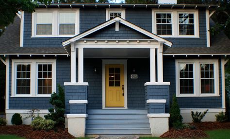 A 1920s Cottage Gets a Moody Blue Makeovergoodhousemag Navy Blue House Exterior, Exterior Remodel Before And After, Navy Blue House, Blue Home Exterior, Blue House Exterior, Navy Blue Houses, Yellow Door, Home Exterior Makeover, Cottage Renovation