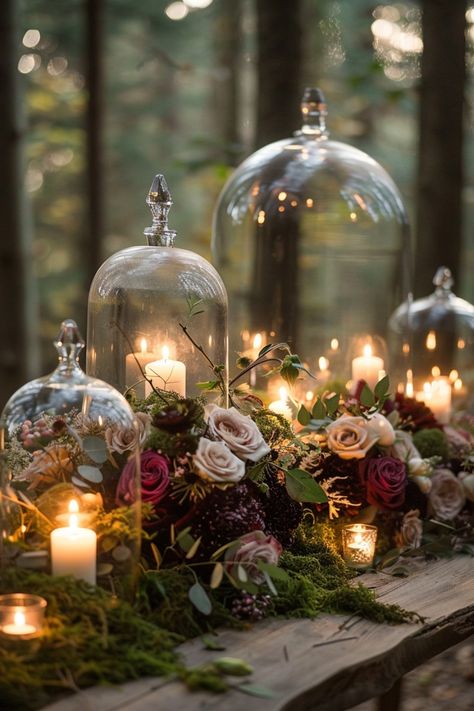 Create a dramatic ambiance with moody wedding centerpieces in rich colors and textures. Get inspired here. Clear Wedding Centerpieces, Moody Jewel Tone Wedding Table Settings, Wedding Centerpieces Fairytale, Candle Centerpieces For Dining Table, Do It Yourself Wedding Centerpieces, Dark Whimsy Wedding, Black Gold Emerald Decor, Moody Romantic Wedding Table Settings, Candle Table Centerpieces Wedding