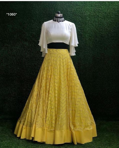 Fabric : 👉 Georgette lehenga with sequence work + canvas patta attach 👉 Japan crepe silk blouse ( 1.5 meter Unstich ) CARE INTRODUCTION:- HAND WASH AND DRY AND CLEAN White Lehenga Choli, Lehenga Choli Latest, Haldi Dress, Haldi Outfits, Crop Top Lehenga, Haldi Outfit, Function Dresses, Georgette Lehenga, Long Gown Design