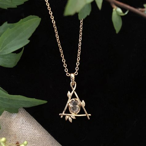 Our Fae Collection was inspired by childhood days spent in the woods talking to the trees and feeling at home with the woodland spirits. Our Fae Necklace is a delicate branch triangle holding a genuine quartz crystal at its center. Brass plated in goldtone. 16" length chain with a 3" extension for adjustable length. Each crystal will be white but with variation of clarity and occlusion due to natural variation in the mineral and no two will be alike. All orders over $50 ship for free within the Feeling At Home, The Fae, Childhood Days, Magical Jewelry, Jewelry Lookbook, Butterfly Jewelry, Jewelry Inspo, Pretty Jewellery, In The Woods