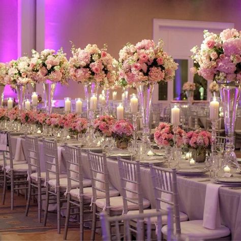 16 Tall and Dramatic Wedding Centerpieces | PreOwned Wedding Dresses Wedding Reception Centerpieces Candles, Long Table Wedding, Flowers And Candles, Pink Centerpieces, Feminine Wedding, Wedding Reception Centerpieces, April Wedding, Reception Centerpieces, Tall Centerpieces