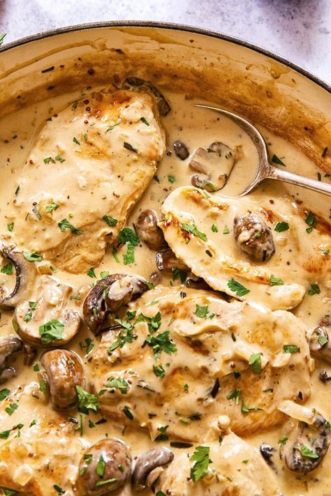 Tender and juicy chicken breasts smothered in garlic mushroom sauce is comfort food that could be in front of you in just 30 minutes! Chicken Thigh With Mushroom Sauce, Creamy Bourbon Chicken With Mushrooms, Chicken And Mushroom Gravy Recipes, Smothered Chicken With Creamed Spinach Mushroom Sauce, Mushroom Recipes Chicken, Grilled Chicken And Mushroom Recipes, Chicken Thighs Mushroom Recipes, Chicken With Garlic Mushroom Sauce, Mushroom Gravy For Chicken