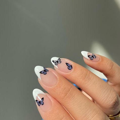 20 Easter Nail Ideas For a Pretty (and Chic) Holiday Mani French Manicure With Butterfly, Butterfly Sticker Nail Art, Butterflies On Nails, French Tip Butterfly, Butterfly Blue Nails, Butterfly On Nails, Nails Butterflies, Butterfly Sticker Nails, Butterfly French Tip