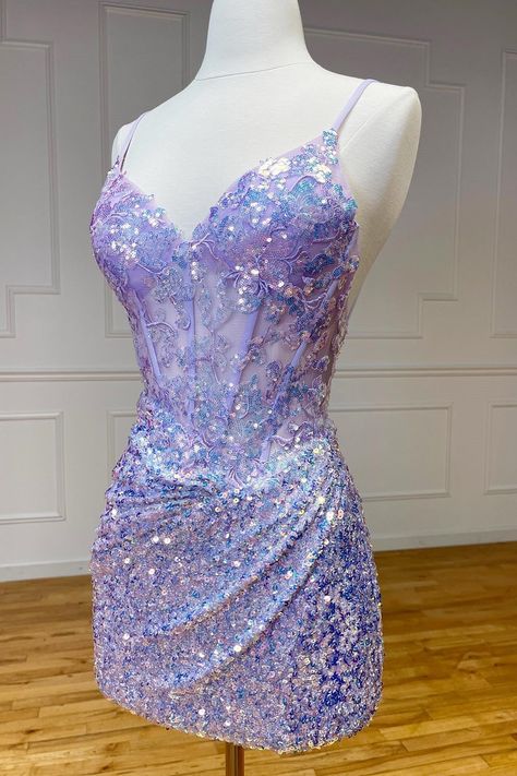 Othello, a dazzling sheath-style homecoming dress in sequin fabric. Available in Purple, Lilac, Green, and Lavender, adorned with shimmering appliques and sequins with a flattering V-neckline and sleeveless design. Complete with a zipper back, Othello is perfect for making a statement with its shimmering elegance and vibrant hues.   Details:     Silhouette: Sheath Style    Fabric: Sequin Fabric    Color: Purple, Lilac, Green, Lavender Color    Length: Short-Mini Length    Neckline: V-Neck    Sle Pretty Prom Dresses Mini, Winter Sweet 16 Dresses, Purple Sweet Sixteen Dresses, Sweet 16 Dresses Purple, Purple Homecoming Dress Short, Purple Birthday Dress, Lilac Homecoming Dress, Purple Hoco Dress, Short Purple Dress