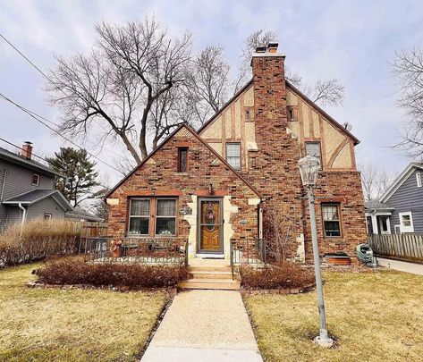 1930 Tudor house in Janesville, Wisconsin 1930s Tudor House, Janesville Wisconsin, Tudor House, Crown Molding, Wood Burning Fireplace, Wisconsin, Old Houses, Hardwood Floors, Fireplace