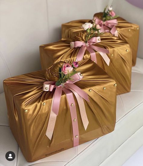 Drinks wrapped in god satin and rose gold ribbons for engagement dowry wrapping. Ribbon Hampers Idea, Shadi Ideas, Traditional African Wedding, Wedding Packing, Hamper Ideas, Rose Gold Ribbon, Naija Wedding, Unique Wedding Cards, Wedding Gift Pack