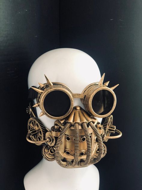 https://www.etsy.com/listing/849756723/steampunk-respirator-mouth-guard-mask?ref=shop_home_active_16&pro=1&frs=1 Steampunk Mask For Cosplay Events, Steampunk Mask Costume Accessories For Fantasy Events, Gothic Gold Masks And Prosthetics For Costume, Steampunk Mask For Fantasy Events, Gold Fantasy Festival Masks And Prosthetics, Steampunk Mask Costume Accessories, Steampunk Costume Accessories For Masquerade And Cosplay, Steampunk Adjustable Masks And Prosthetics For Festivals, Steampunk Adjustable Masks And Prosthetics For Halloween