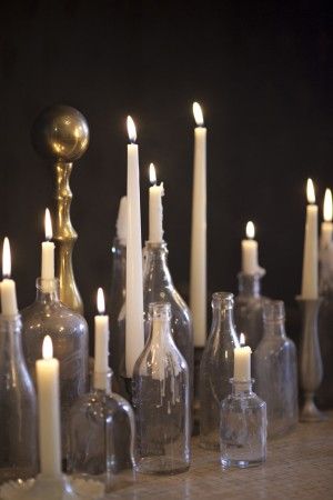 use empty (alcohol) bottles with labels removed to hold candles White Candles Wedding, Tea Dance, Candles In Fireplace, Valentines Inspiration, Elizabeth Anne, Bottle Candles, Hanging Flower, Vintage Bottles, Old Bottles