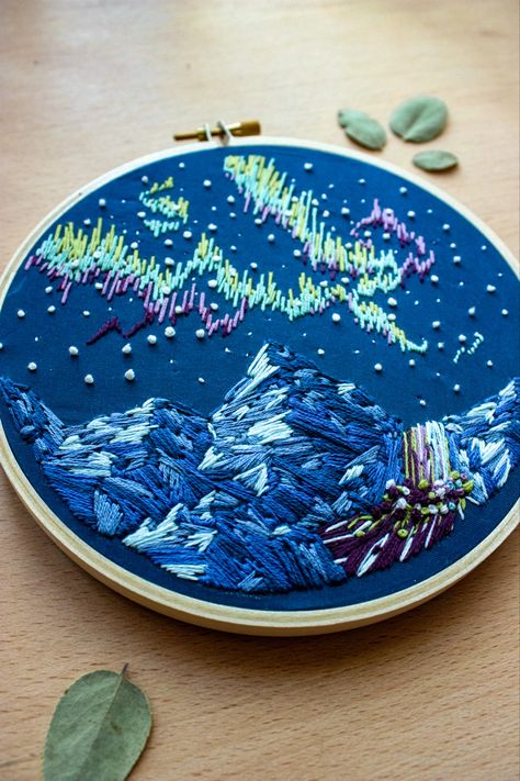 An embroidery hoop depicting a winter mountain scene with the northern lights Iceland Embroidery, Northern Lights Embroidery, Embroidery Landscape, Mountain Waterfall, Handmade Embroidery Designs, The Northern Lights, Handmade Embroidery, Embroidery Ideas, Embroidery Inspiration