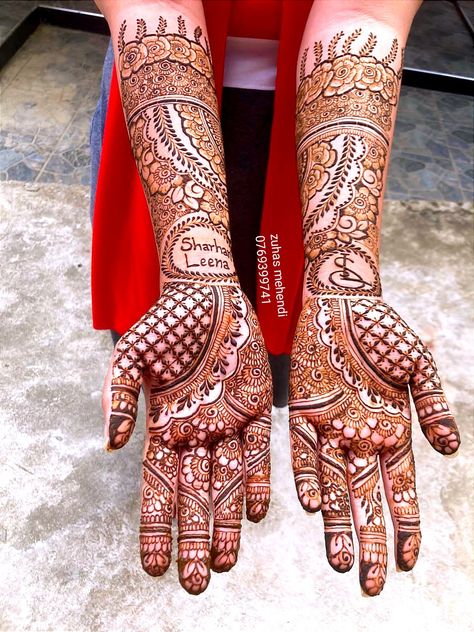 zuhas mehendi Call 0769399741 For booking your appointment Available in kandy and suburbs Bridal Mehndi Designs South Indian, Mehandi With Name, Grooms Name In Mehendi, Bridal Mehendi Back Hand With Name, Mehendi With Names, Bridal Mehendi With Name, Mehendi Design With Name, Groom Name In Mehndi Design, Bridal Mehndi Designs With Names