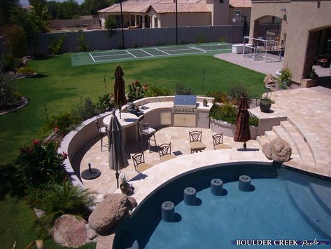 love this outdoor kitchen and pool bar, complete with submerged seats - wow. Pool Bar Design, Pool And Patio, Living Pool, Outdoor Kitchen Countertops, Outdoor Kitchen Bars, Outdoor Kitchen Appliances, Swim Up Bar, Blue Tile, Dream Pools