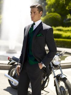 Stylish groomsmen's ensemble in dark green with a gray suit. White Tuxedo Wedding, Grey Tuxedo, A Man In A Suit, Man In A Suit, Costume Noir, Groom Tuxedo, Vest And Tie, Red Vest, Tuxedo Wedding