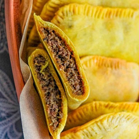 This is a recipe for classic Jamaican beef patties with a rich and flavorful ground beef filling inside crisp and flaky golden pastry. Easy Jamaican Beef Patties Recipes, Homemade Jamaican Beef Patties, Jamaican Beef Patty Filling, Jamaica Beef Patty Recipe, Vegan Jamaican Beef Patties, Beef Patties Recipes, Jamaican Beef Patties, Jamaican Patty, Hand Pies Savory