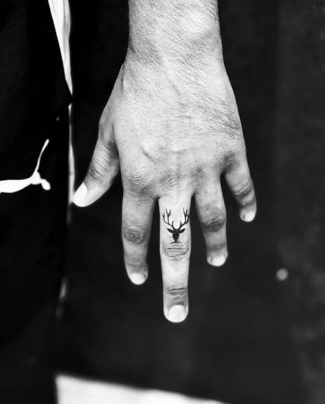 Deer Finger Tattoos For Men Deer Tattoo On Finger, Minimalist Tattoo Men Finger, Deer Skull Finger Tattoo, Tattoo For Finger Men, Deer Finger Tattoo, Deer Hand Tattoo, Men Finger Tattoo Ideas, Fingers Tattoo Men, Small Finger Tattoos Men