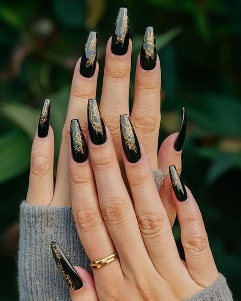 Glamour in Gold: Where Elegance Meets Edge! ✨🖤 Shine bright like the star you are with these stunning gold and black nails! 🌟💅 This perfect fusion of luxe gold and deep black creates a chic look that's effortlessly elegant yet daring. Whether you're dressing up for a special occasion or adding glam to your everyday style, these nails are your new go-to accessory! 💖💫 Swipe for the sparkle and let your fingertips do the talking! #goldandblack #glamnails #chicelegance #nailartgoals #art #nails #... Black With Gold Foil Nails, Matt Black And Gold Nails, Gold And Black Nails, Gold Foil Nails, Black And Gold Nails, Long Black Nails, Golden Pattern, Glam Nails, Foil Nails