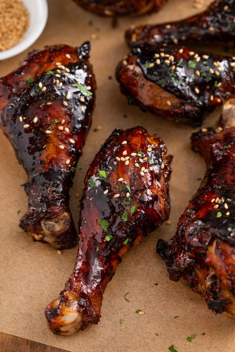 These sweet & sticky baked chicken drumsticks are the perfect appetizer or easy dinner! Tender chicken legs are coated in a sticky, addictive glaze packed with Asian flavors and baked until juicy. These are absolutely the BEST baked drumsticks! How Long To Bake Chicken Drumsticks, Sweet And Sticky Chicken Drumsticks, Asian Drumsticks Baked, Korean Chicken Legs Recipe, Teriyaki Chicken Drumsticks Oven, Korean Drumsticks Recipe, Barbecue Chicken Legs In The Oven, Sheet Pan Drumsticks, Chinese Drumsticks