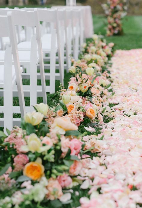 Don't wait for a flower girl to sprinkle the petals—create a plush floral aisle runner. Add larger arrangements next to the chairs to create a defined, super-romantic pathway to the altar. Wedding Aisle Outdoor, Aisle Flowers, Wedding Aisle Decorations, Wedding Ceremony Flowers, Wedding Flower Inspiration, Ceremony Flowers, Aisle Decor, Pastel Wedding, Wedding Arrangements