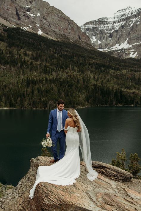 Glacier National Park Spring Wedding Elopement | Montana Photographer | Wedding day details. From enchanting wildflower backdrops to unforgettable hiking and camping experiences, prepare to be blown away. Find unique wedding ideas elegant, wedding glacier national park, glacier national park montana elopement and elopement in glacier national park. Book Brogan to capture your unique elopement pictures at photographybybrogan.com. Glacier National Park Wedding Elopements, Small Montana Wedding, Colorado Wedding Pictures, Montana Wedding Elopement, Destination Wedding Montana, Eloping In Glacier National Park, Wedding National Park, Eloping In The Mountains, Elopement In The Mountains