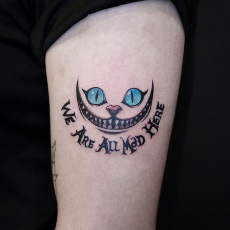 cool 26 Cheshire Cat Tattoos for Wonderland in 2021 Chester The Cat Tattoos, Cheshire Smile Tattoo, Small Cheshire Cat Tattoo, Chesire Cat Tattoos Simple, Cheshire Cat Tattoo Design, Cheshire Cat Tattoos, Alice In Wonderland Tattoo Cheshire Cat, We Are All Mad Here Tattoo, Cheshire Cat Smile Tattoo