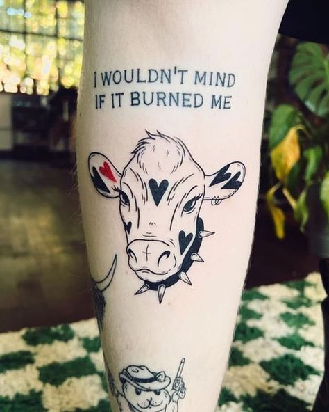 Step into the farmyard of fashion with cow tattoo designs! We've rounded up over 70 cow tattoo ideas that are just udderly irresistible. Cow With Hearts Tattoo, Flying Cow Tattoo, Heart Cow Tattoo, Calf Cow Tattoo, Traditional Cow Tattoo, Matching Cow Tattoos, Cow Tatoos, Cute Cow Tattoo, Cow Tattoo Small