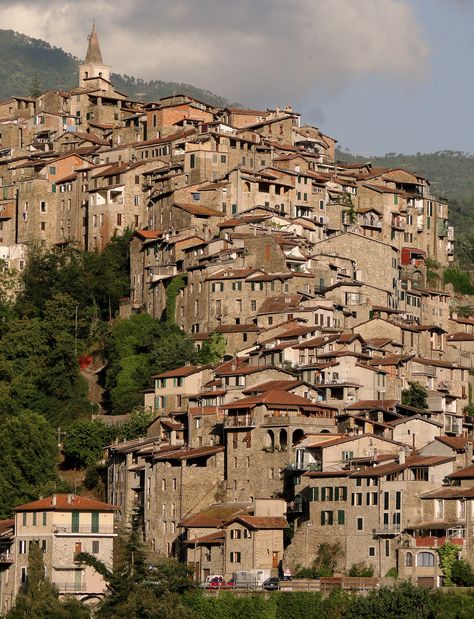 There is a ‘secret’ fairytale valley in Italy that not many people know about, where hill towns are piled on top of one another and tumble vertically down mountains. Apricale is the sho… Italian Hill Towns, City On A Hill, Architecture Photography Buildings, Italian Town, Hill City, Italian City, Down Town, Italian Village, Italian Architecture